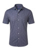 Men's short-sleeve button-up shirt in slate blue with an all-over geometric pattern, featuring a chest pocket and white buttons.