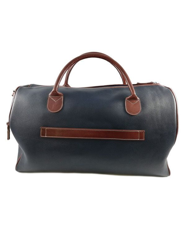 A stylish black leather duffel bag with brown leather handles and accents, placed against a white background, conveys a professional and classic tone.