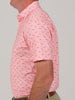 Lifestyle photograph depicting a golfer on the course wearing Donald Ross performance clothing, emphasizing premium golf style, athletic fit, and timeless design.