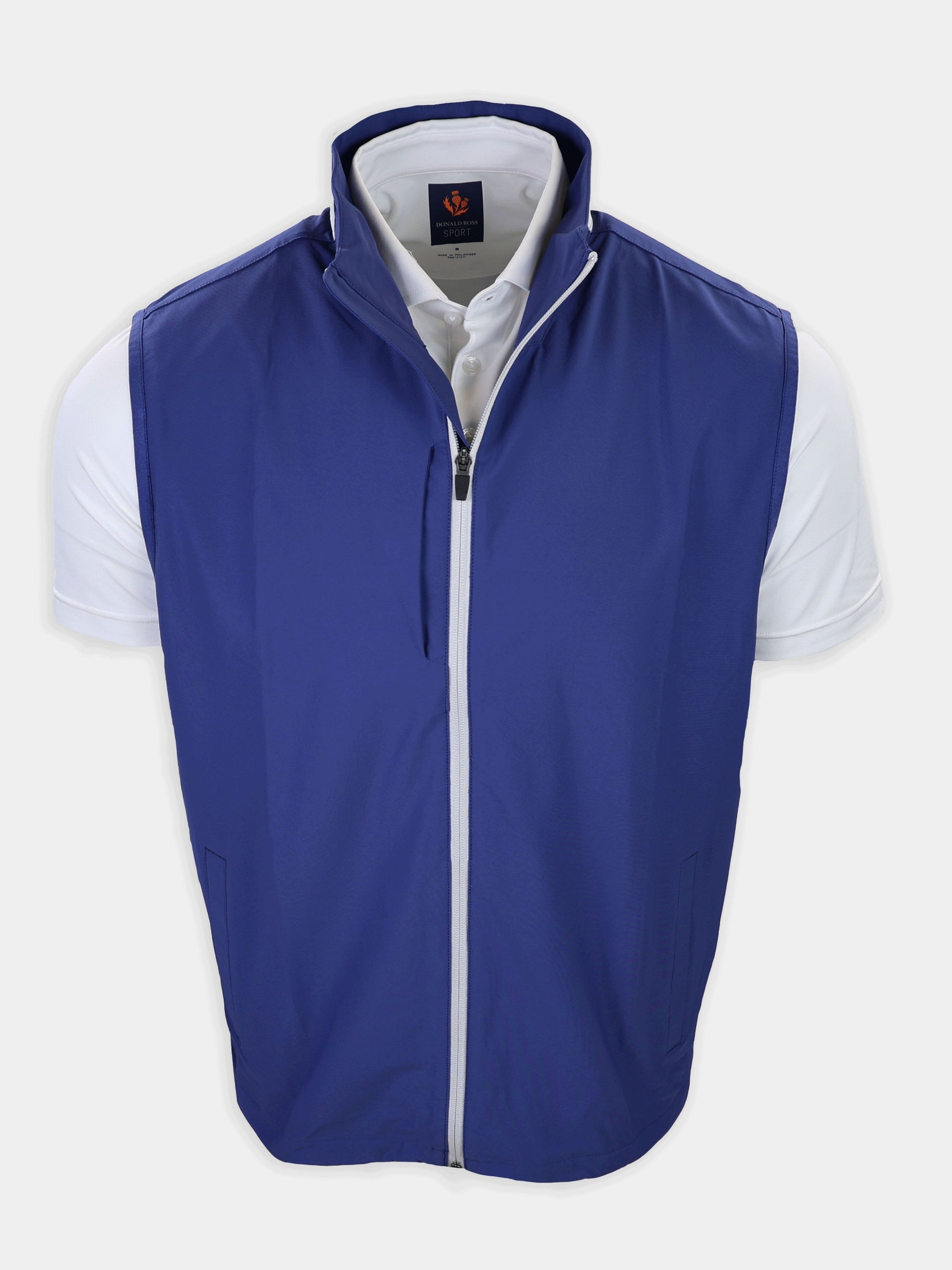 Navy blue athletic vest with a zipper is displayed over a white shirt.