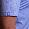 Close-up of the sleeve on a men's wishbone print polo.