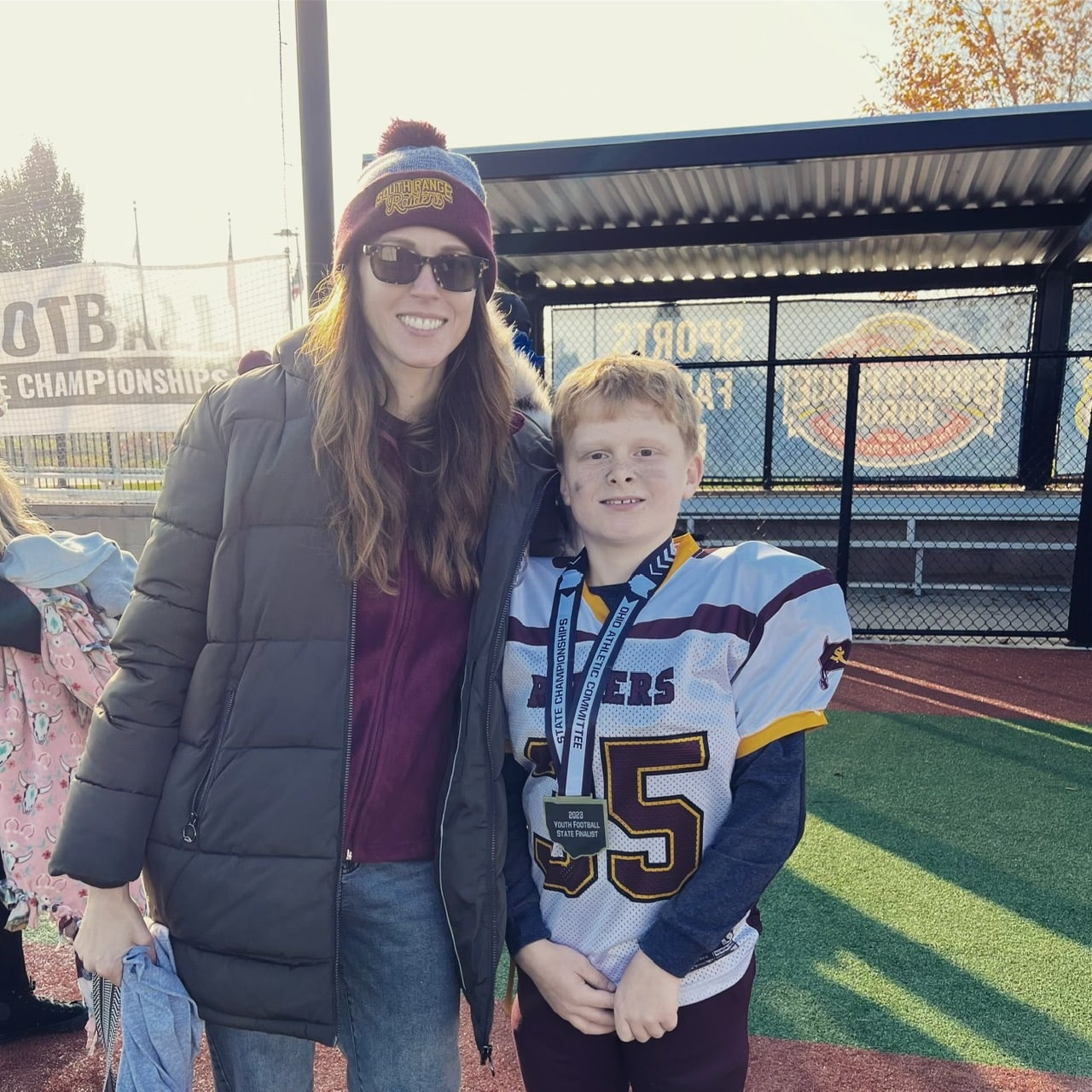 Heather with son at football game